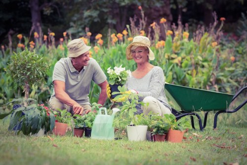 Gardeners applying health and safety measures during outdoor work