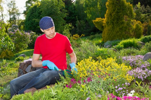 Local gardeners working on a well-kept garden in Marks Gate